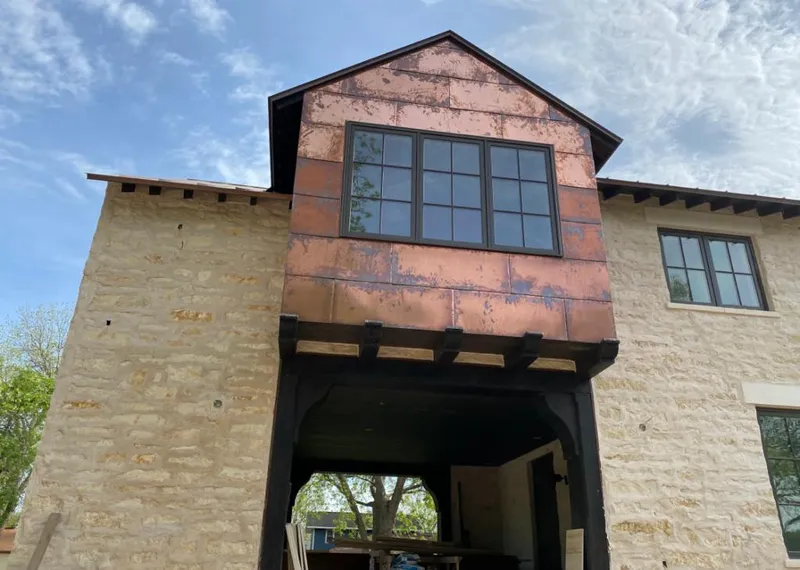 Copper metal panel facade on a stone building for Skylight Installation in Campbell